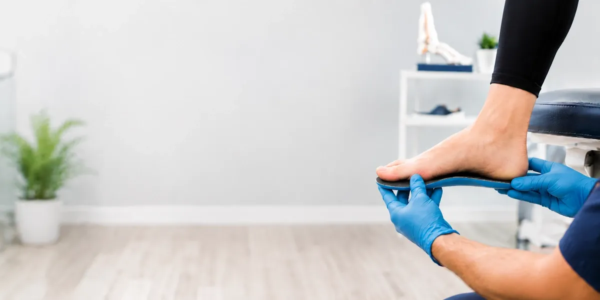 Custom orthotics fitting at Jayhawk Foot & Ankle Clinic